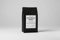 Coffee bag with branding and product details on a white background