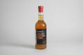 Bottle of rum with a red cap on a white background