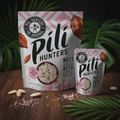 Pili Hunters Himalayan Salt Pili Nuts styled with raw pili nuts and Himalayan salt crystals on dark wood surface